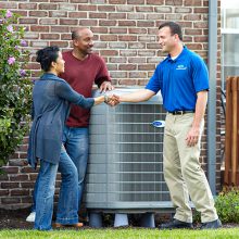 hvac contractor talking with couple