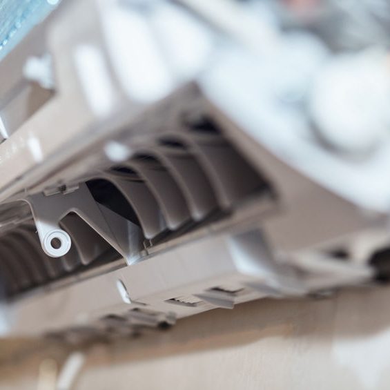 Inverter Air conditioning service, repair and maintenance concept. The specialist cleans and repairs the wall air conditioner. Picture technician cleaning coil cooler of air conditioner