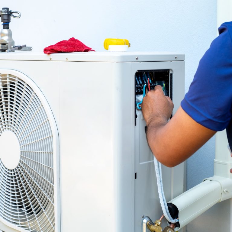 230057545_m_normal_none Male technician installing outdoor unit of air conditioner