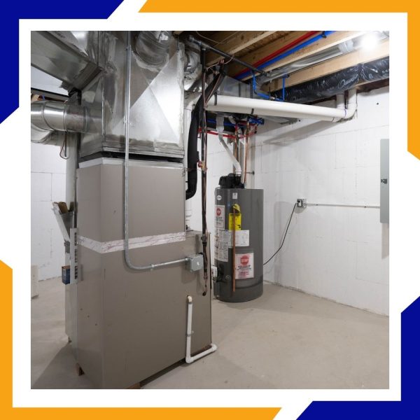 Heating Repair Brighton 3 A clean basement utility room showing a professionally installed furnace and water heater system.