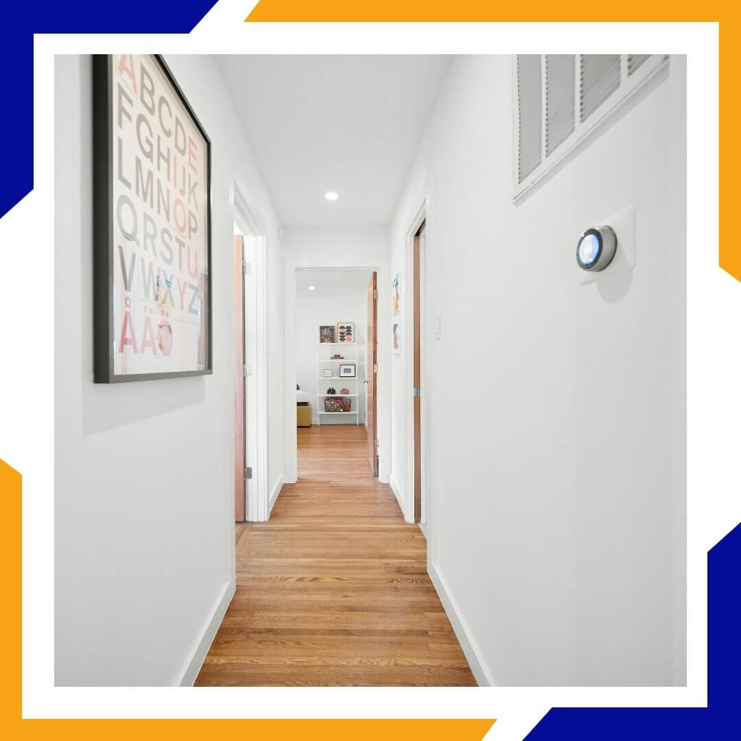 hallway with thermostat on wall
