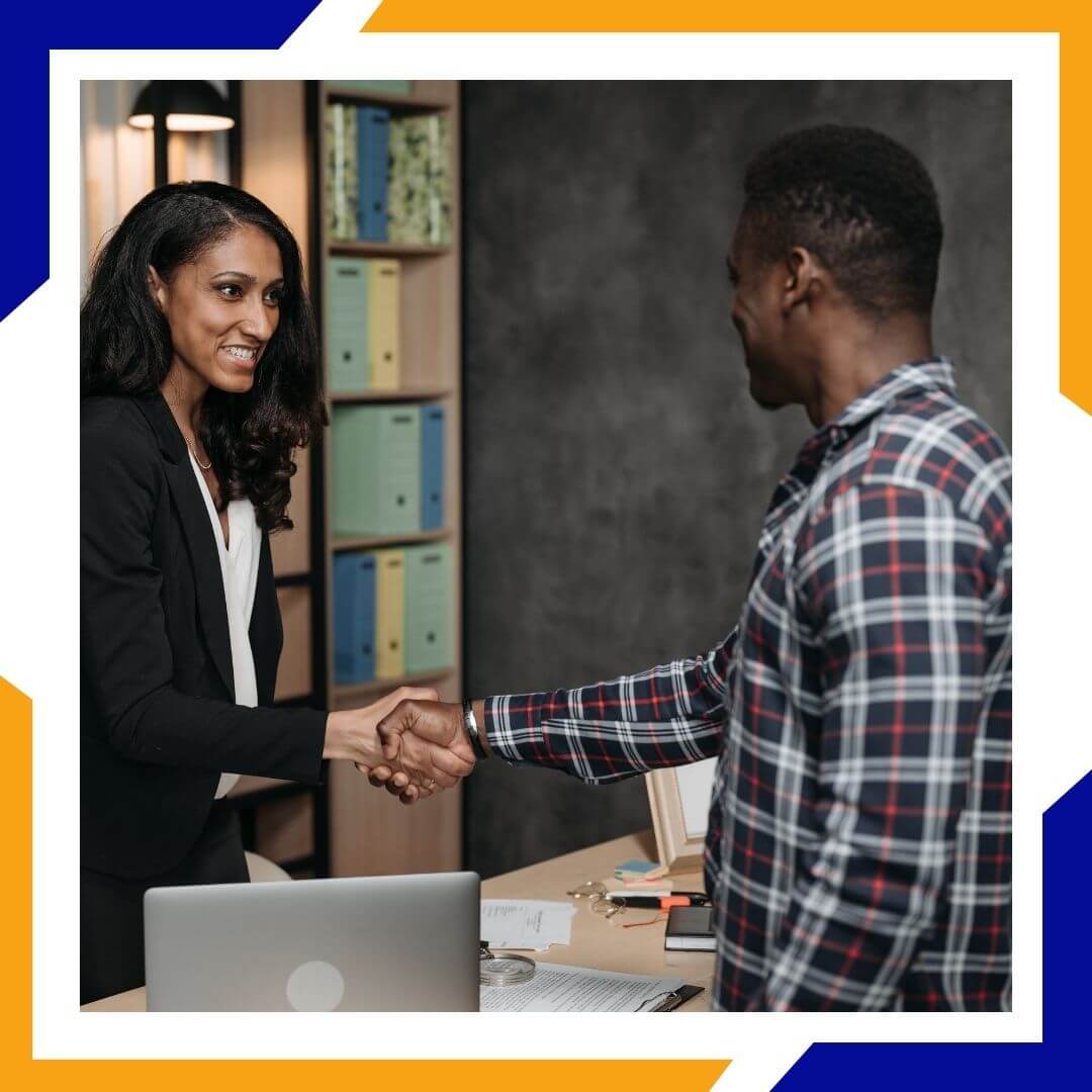 HVAC tech shaking hands with client